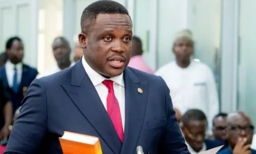 Ghanaian flag waving with a smartphone displaying SIM card registration information