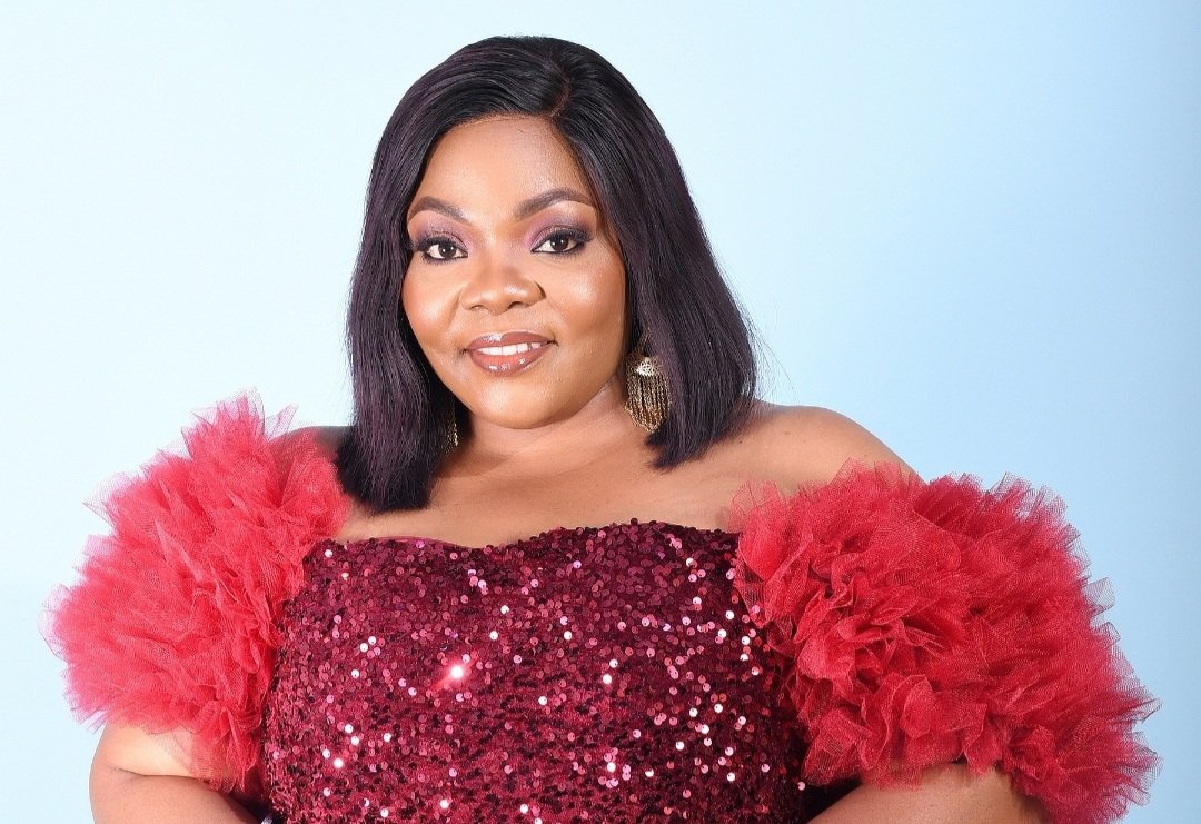 Celestine Donkor performing on stage