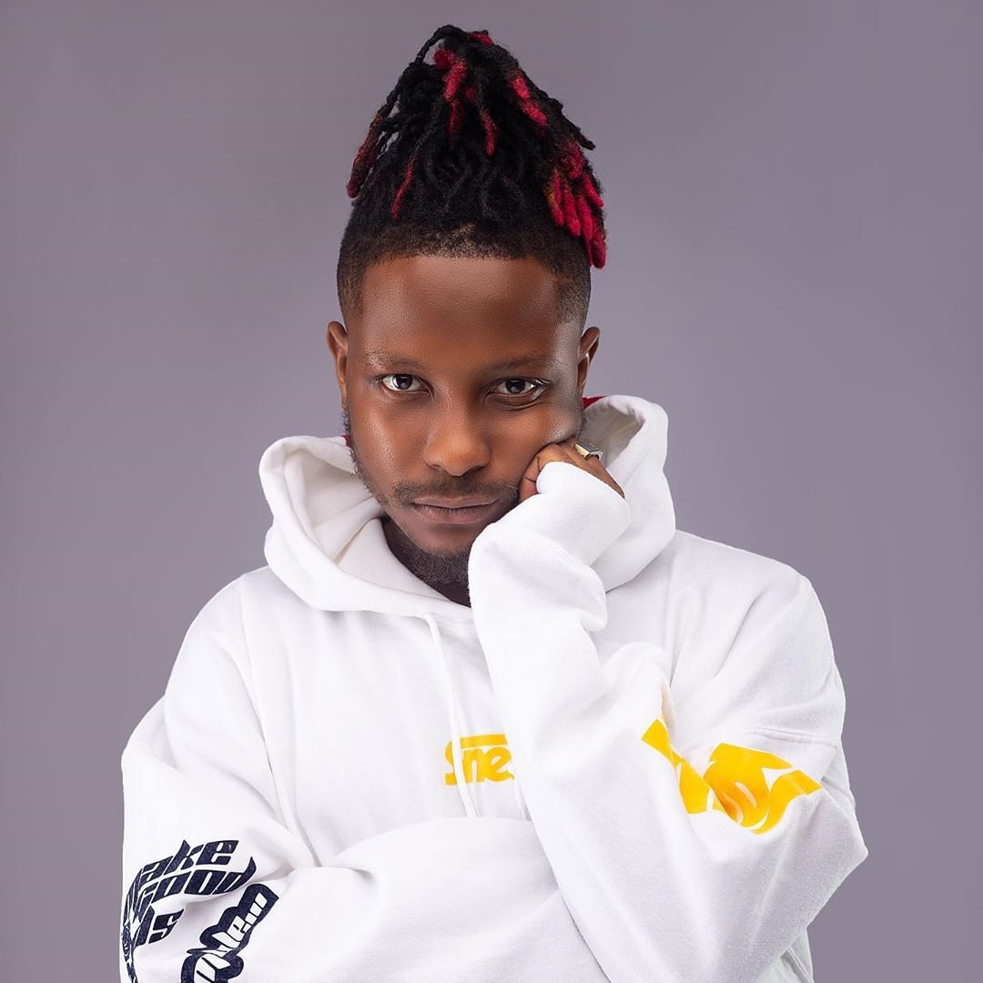 Kelvyn Boy performing on stage at a concert