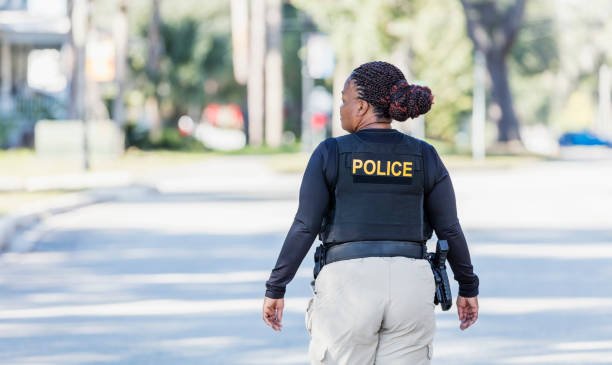 Police officer interacting positively with a child during a community event