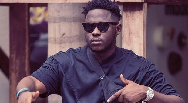 Medikal speaking to a crowd as an anti-drug ambassador