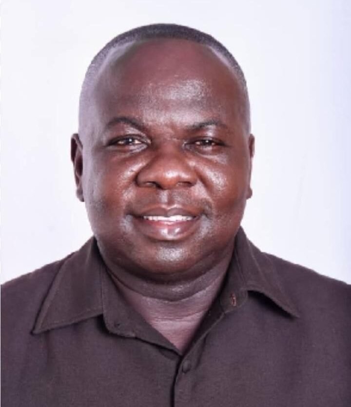 Ghana prison officer in uniform standing guard.
