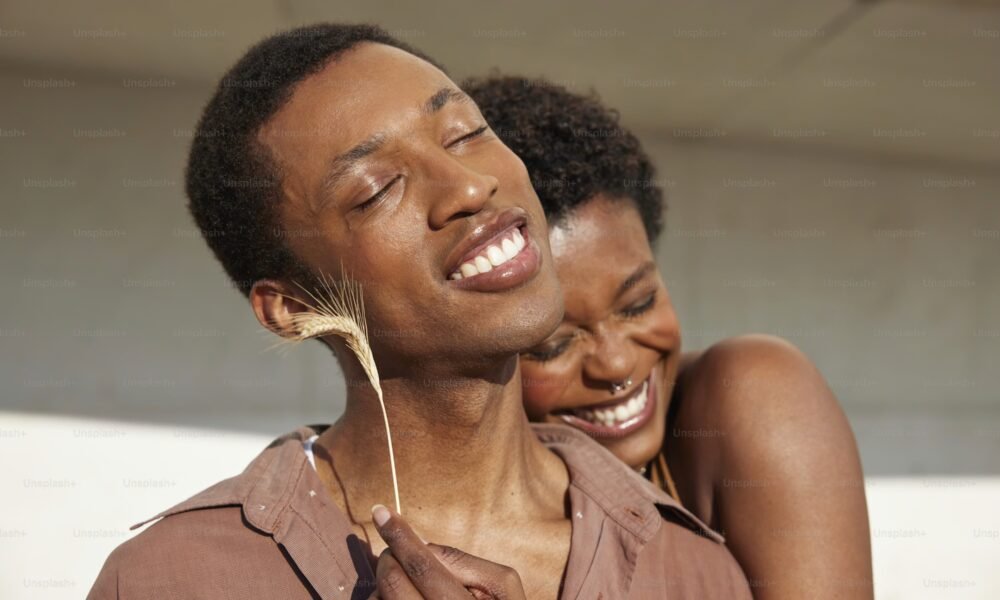 Couple embracing, with one partner appearing overwhelmed