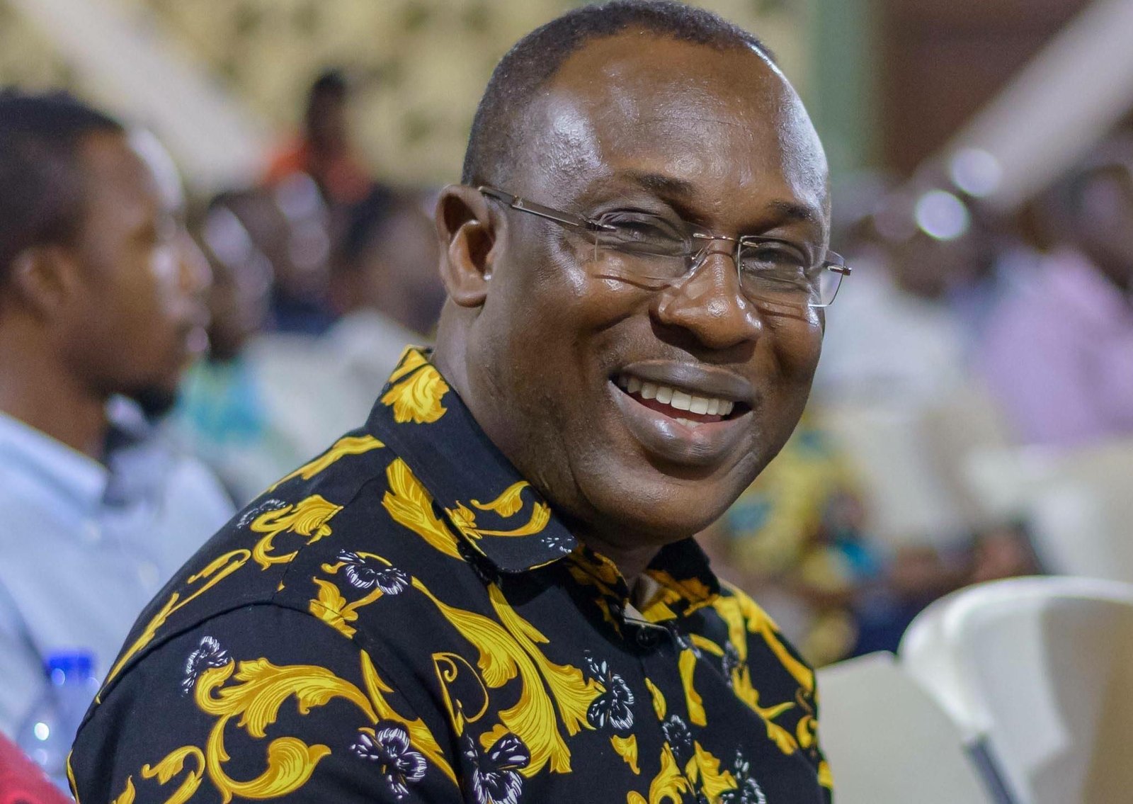 Ghanaian parliament building with protest signs