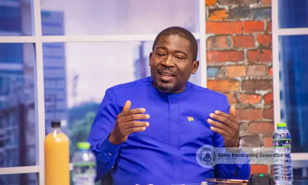 A white Toyota Voxy parked on a street