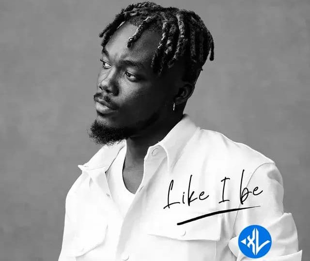 Close up shot of a microphone and notebook during a recording session