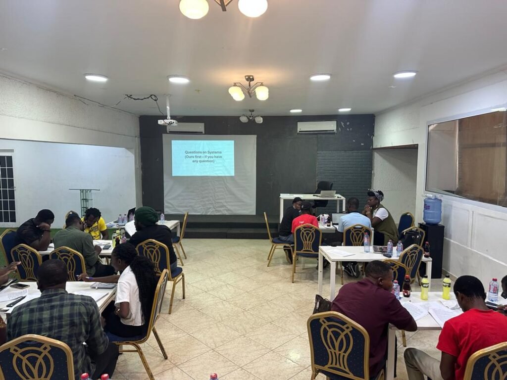 Fighters League leaders taking notes during a classroom session