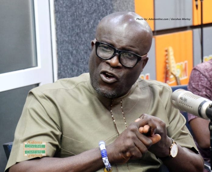 Busy street market in Ghana with local vendors and shoppers