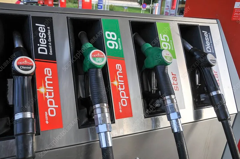 A close-up of a fuel pump nozzle at a gas station