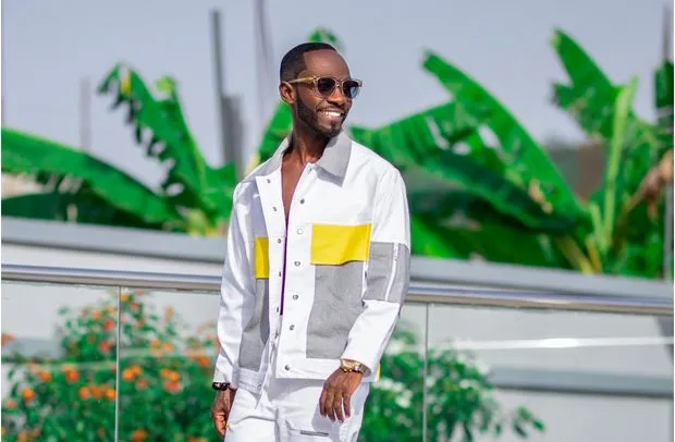 A candid shot of Okyeame Kwame reflecting on family values