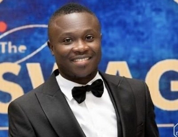 A coach drawing up a new game plan on a whiteboard near the sidelines