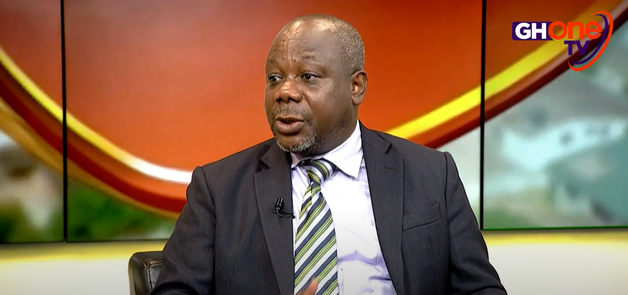 A close-up of essential grocery items like rice and butter in a local market