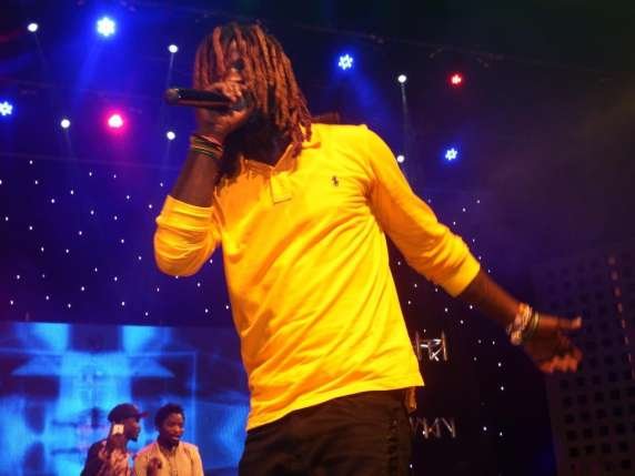 Ghanaian rapper Showboy looking thoughtful during a performance