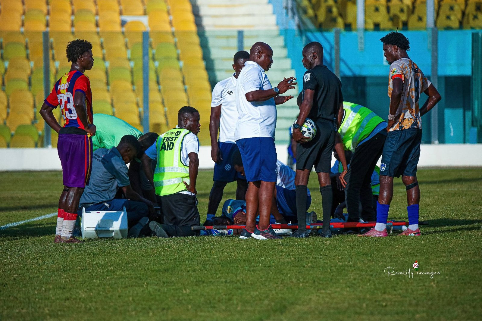 A football team standing together on the pitch during a match day