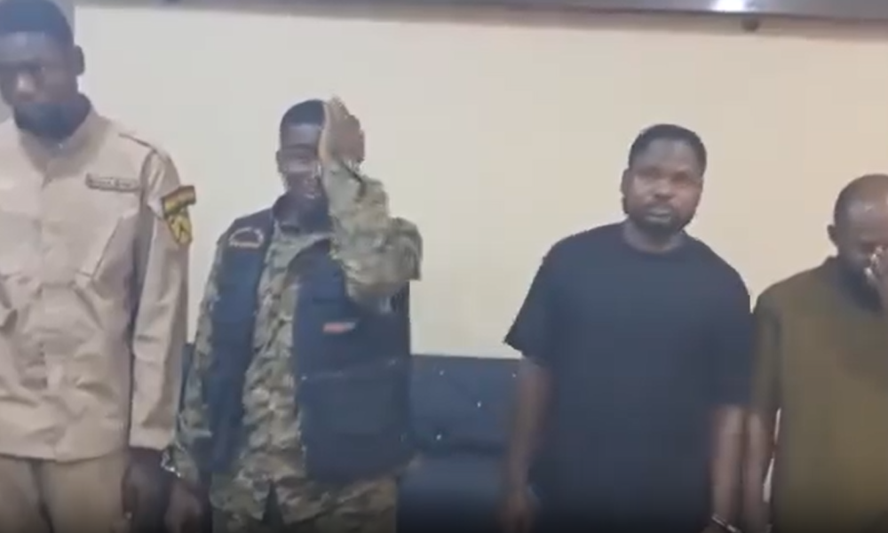 Reagan Amponsah Asare during police processing in Ghana