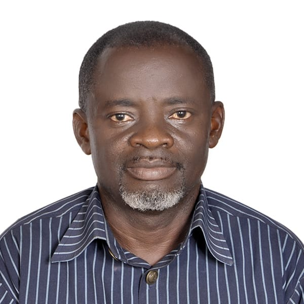 A lush green school farm with students tending to maize crops